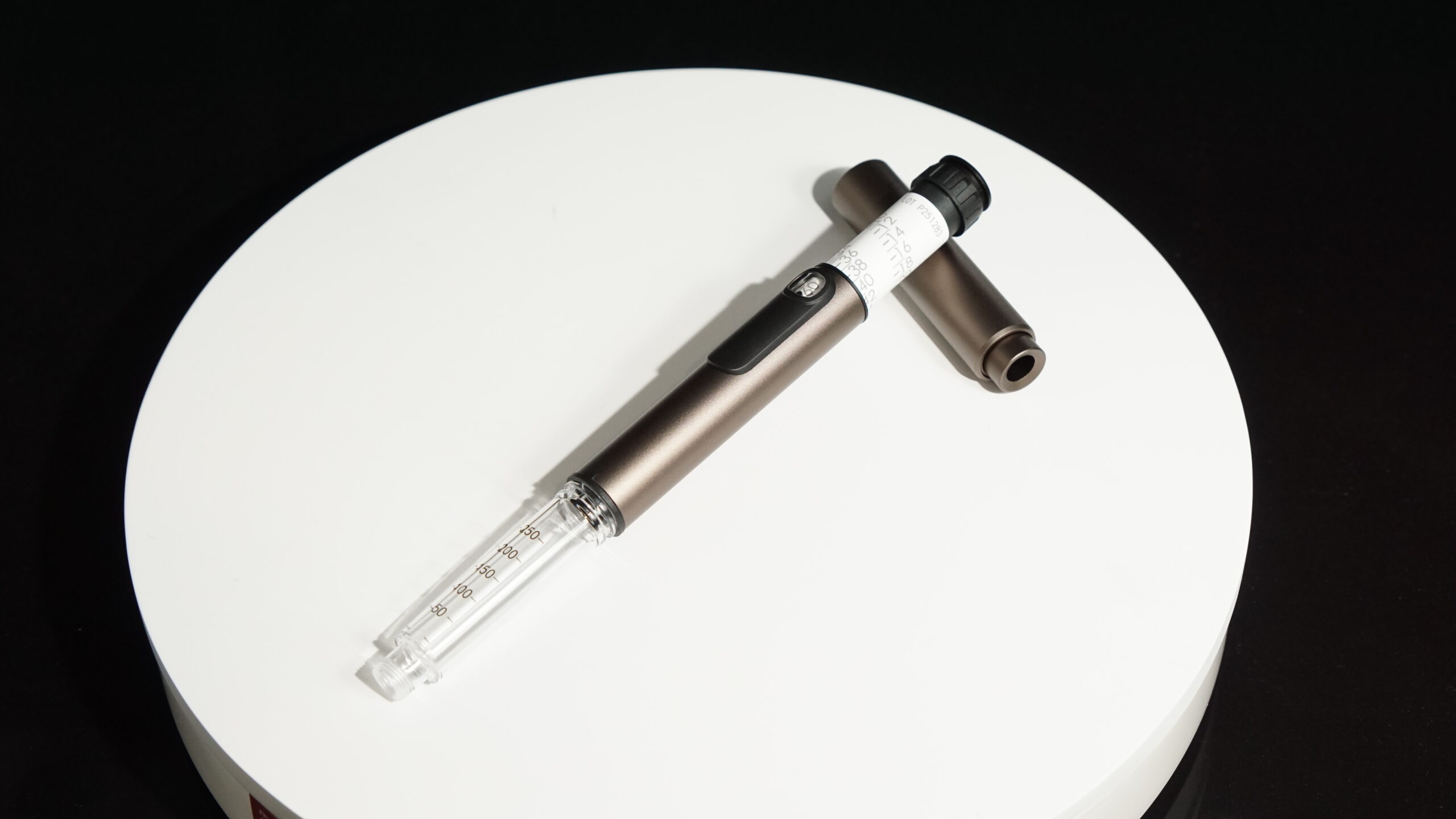 Gray PepPen V2 shown in 3 parts