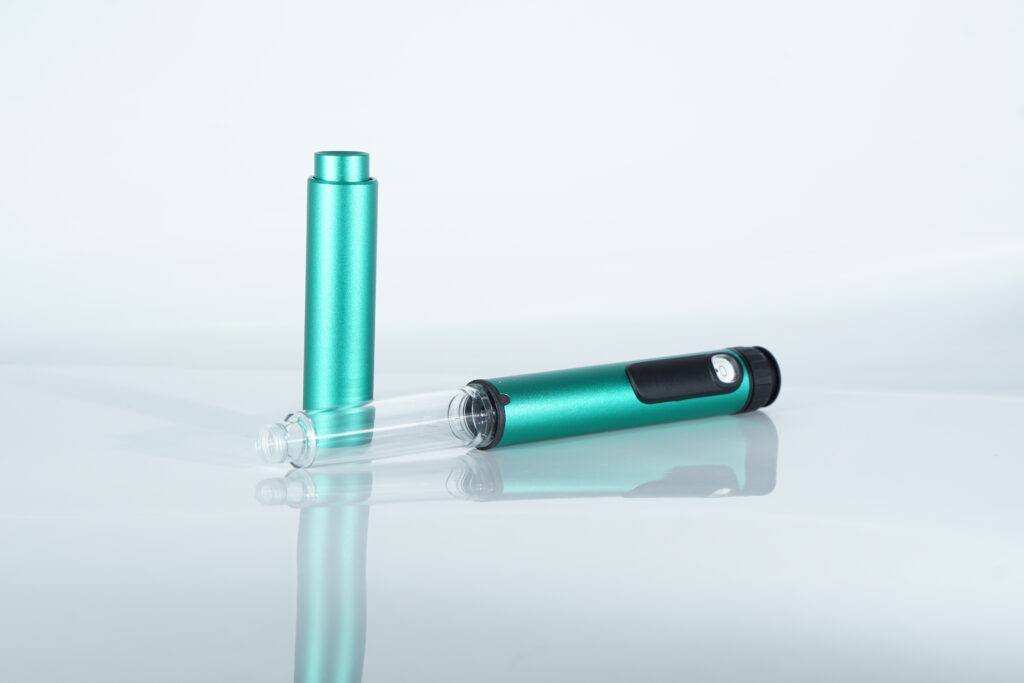 Green PepPen V2 separated into two parts showing the cartridge holder